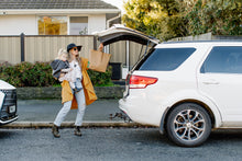 Load image into Gallery viewer, Founder Zoey wearing the Mustard Chloe Layer in the small - medium over jeans