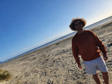 Load image into Gallery viewer, Here is Maru sporting our Signature Rust Crew on the beach. This is made of Organic Cotton and Recycled polyester. Maru wears a 2XL so that he can fit a shirt or long sleeve comfortably underneath.