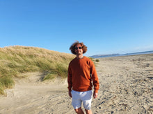 Load image into Gallery viewer, Here is Maru sporting our Signature Rust Crew on the beach. This is made of Organic Cotton and Recycled polyester. Maru wears a 2XL so that he can fit a shirt or long sleeve comfortably underneath.
