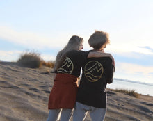 Load image into Gallery viewer, Zoey and Maru on beach wearing Origin Organic Cotton Joggers  (Maru is a Large, Zoey in a small). Certified, ethically made in factory powered by solar and wind energy