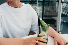 Load image into Gallery viewer, Simplicity Meets Sustainability 🌞
The Eco Luxe Oversized T-Shirt in white is your go-to for clean, conscious style. With Fair Wear, PeTA Vegan, and Climate Neutral certifications, this piece is as pure as it looks—perfect for layering or as a standalone statement of sustainable fashion
