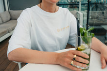 Load image into Gallery viewer, Brighten Your Wardrobe Sustainably 💚
Slip into eco-conscious style with the white Eco Luxe Oversized T-Shirt. Crafted from GOTS-certified organic cotton using renewable energy, it’s the ultimate white tee for those who love both comfort and a cleaner planet.
