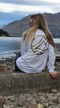 Load image into Gallery viewer, Zoey sporting out Long sleeve white organic cotton top. This is the back
