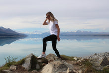 Load image into Gallery viewer, Ribbed Dream Leggings worn by Zoey walking around Lake Pukaki. Zoey is wearing a size small/medium. These are mid to high wait, 4 way stretch. Super versatile , can be used for so many activities. They can be dressed up with a blazer and nice top, boots or cute little heel. They can be worn to work, the gym, the school run, yoga, coffee, groceries, parent teacher interviews, fashion show, hanging at home, marathons ... literally whatever the occasion are a dream!
